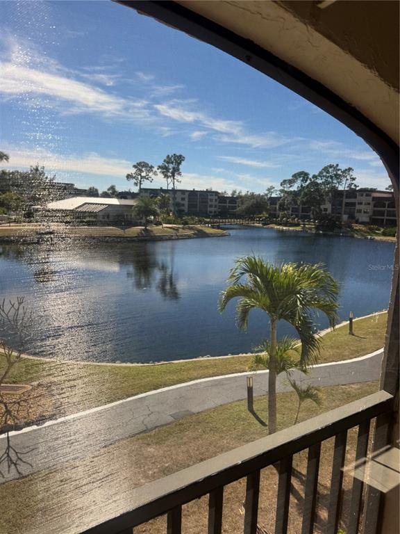 23465 Harbor View Road, Unit 201 Punta Gorda, FL 33980 - Photo 33 of 50 a view of a lake from a balcony