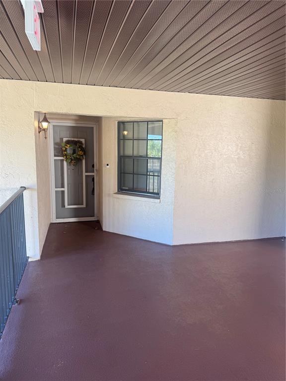 23465 Harbor View Road, Unit 201 Punta Gorda, FL 33980 - Photo 4 of 50 a view of an empty room with a window