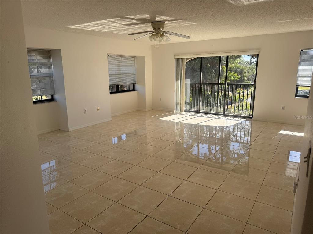 23465 Harbor View Road, Unit 201 Punta Gorda, FL 33980 - Photo 7 of 50 a outdoor space with sliding door and windows