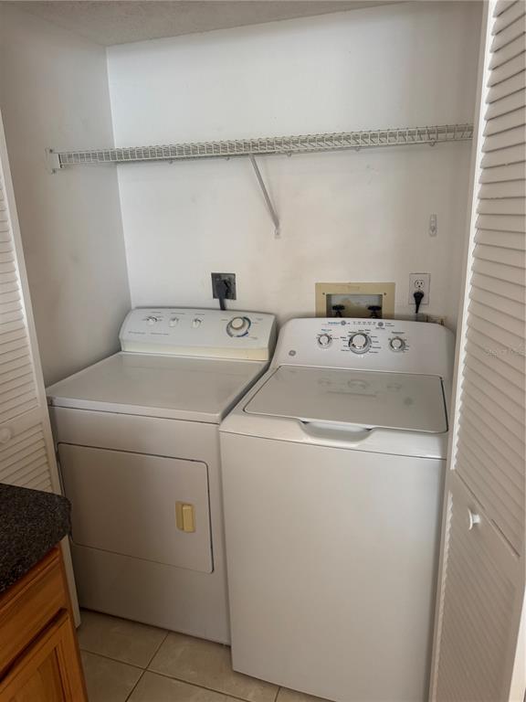 23465 Harbor View Road, Unit 201 Punta Gorda, FL 33980 - Photo 10 of 50 a utility room with dryer and washer