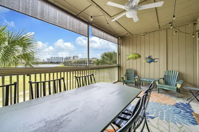 a view of a balcony with chairs