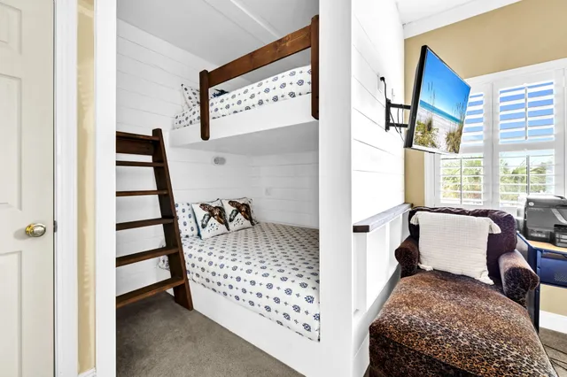 a bedroom with furniture and a window