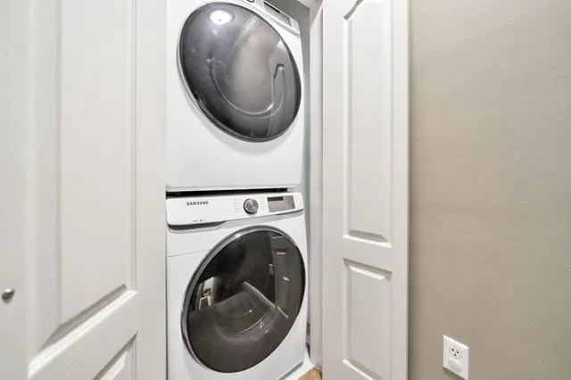 a close view of a utility room with dryer and washer