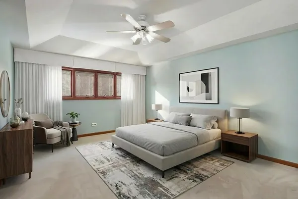 a bedroom with a bed couch and window