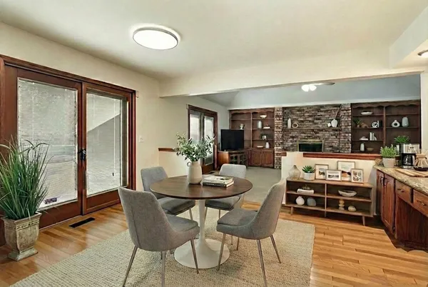 a dining room with furniture and window