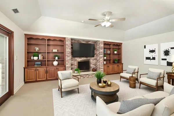 a living room with furniture and a fireplace