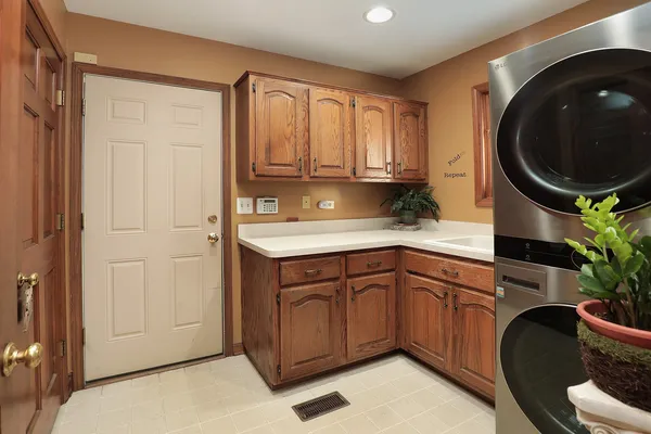 a kitchen with a sink a stove and cabinets
