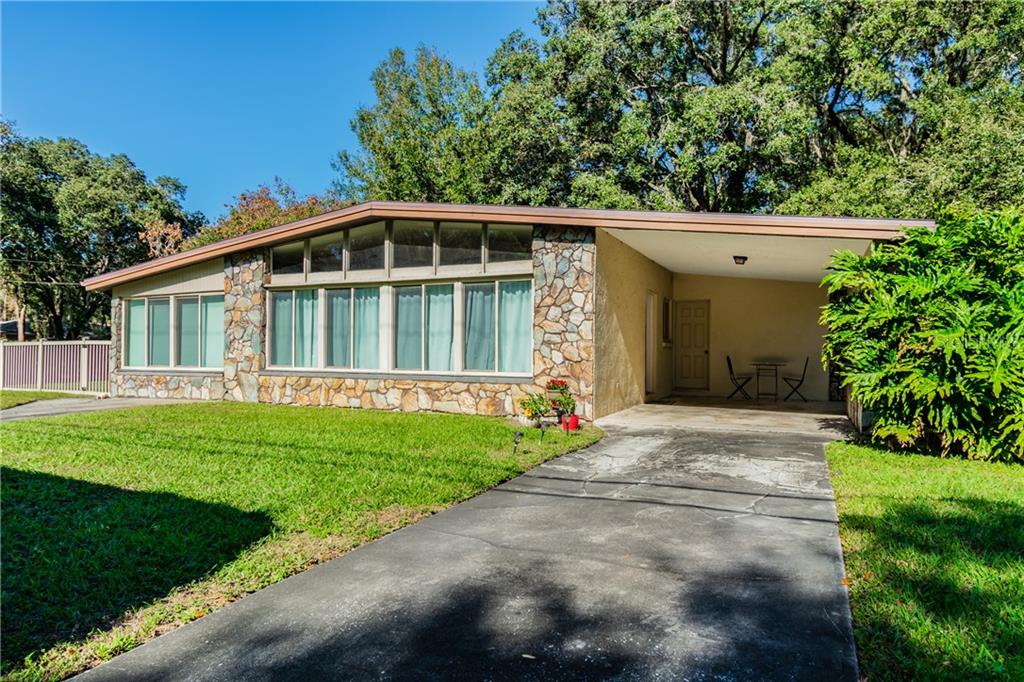 205 Crenshaw Lake Road Lutz, FL 33548 - Photo 1 of 1 Front of home, carport