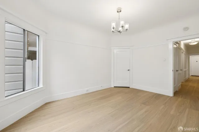 a view of a chandelier in an empty room
