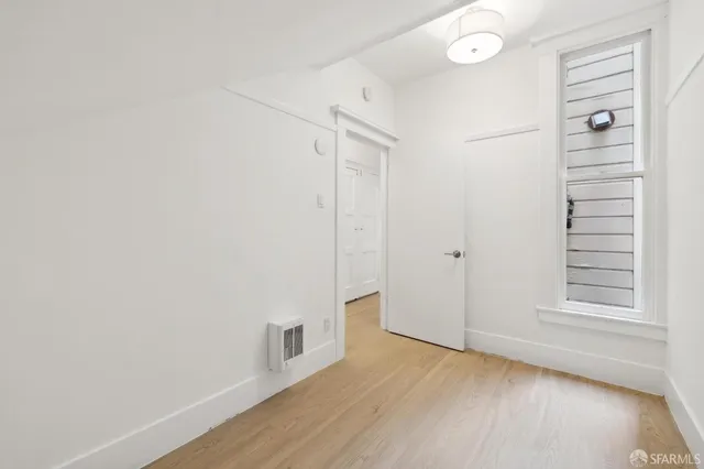 a view of a room with white walls