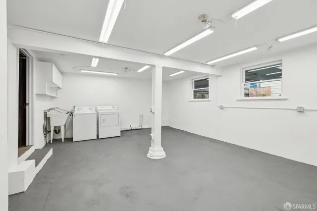an empty room with white walls and white doors