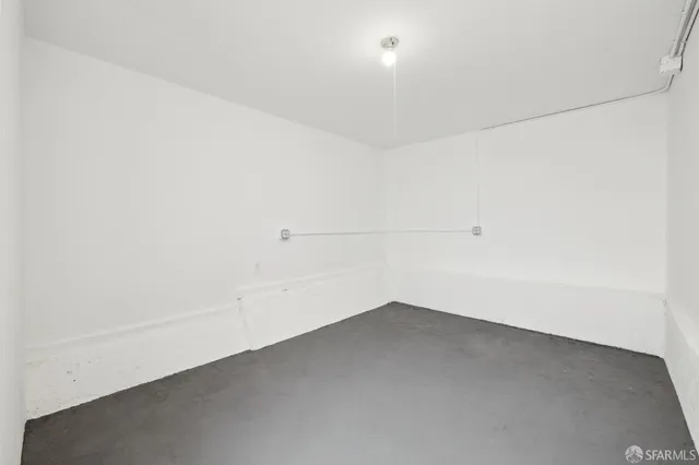 a view of a big room with closet and windows