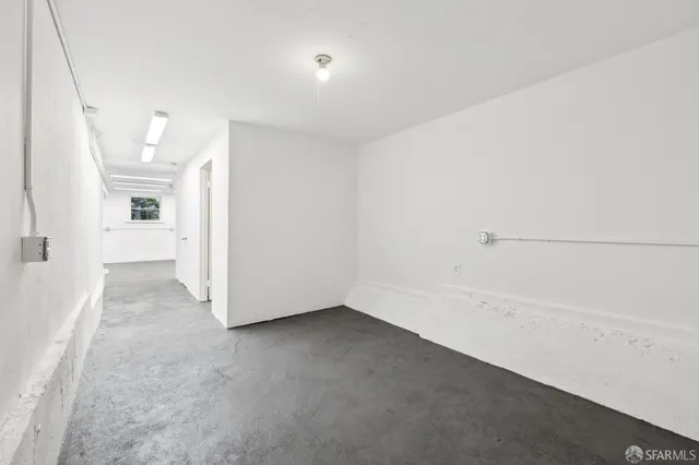 a bathroom with a toilet a sink and a mirror