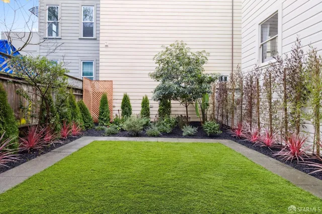 a view of a backyard with garden
