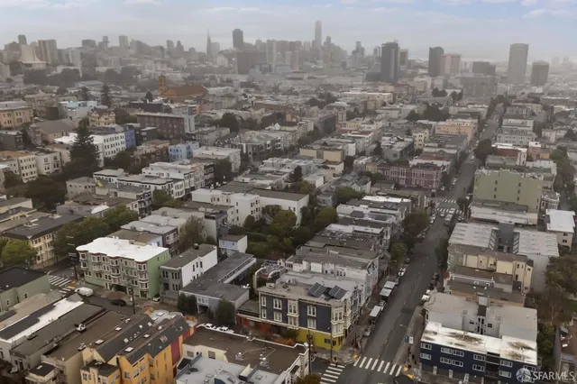 an aerial view of a houses with outdoor space