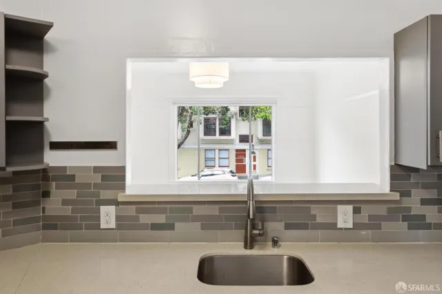 a kitchen with a sink and a window