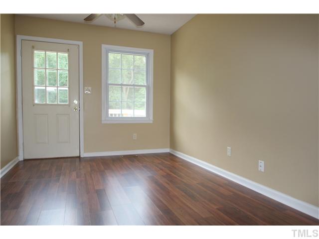 1685 Jack Road Clayton, NC 27520 - Photo 5 of 14 Dining room with new flooring, ceiling fan and painted walls