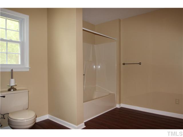 1685 Jack Road Clayton, NC 27520 - Photo 9 of 14 Master spa with new vanity top and fixture, new laminate flooring