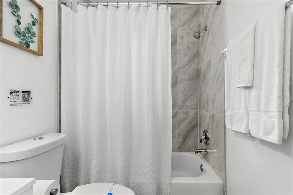 5596 100th Way North St. Petersburg, FL 33708 - Photo 33 of 67 a bathroom with a sink and a toilet
