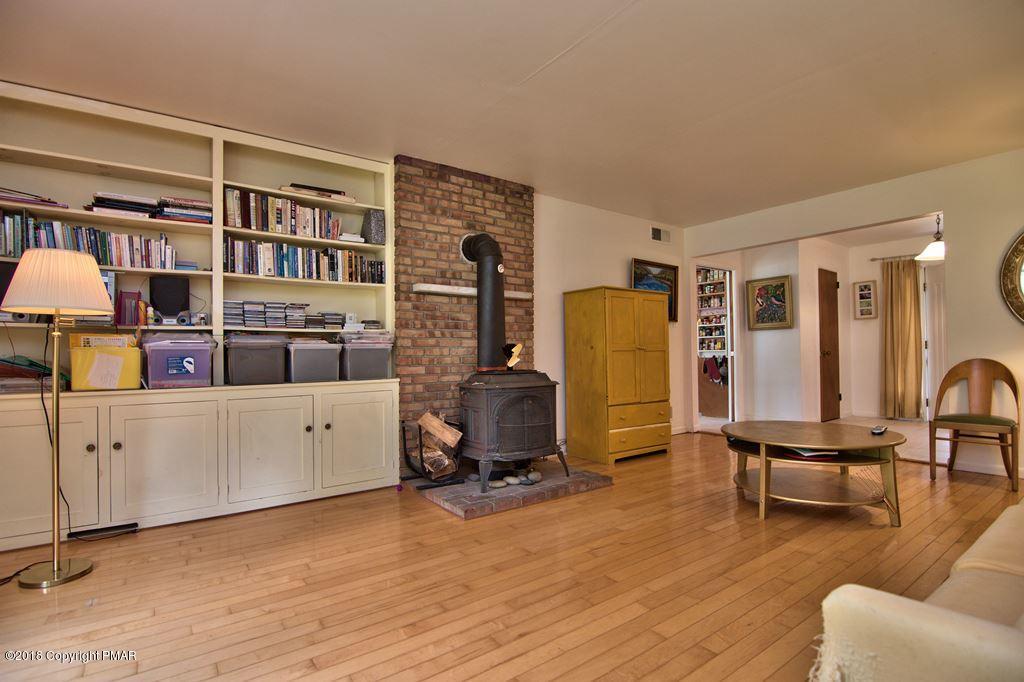 5208 Neola Road Stroudsburg, PA 18360 - Photo 12 of 56 Built-In Bookcases & Hardwood Floor