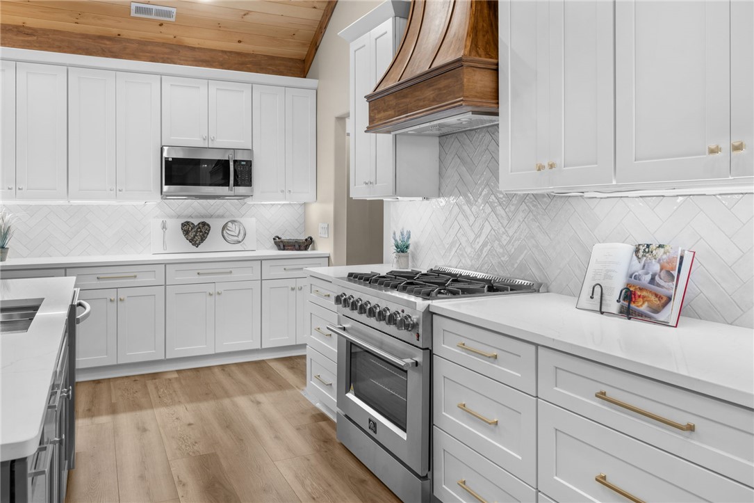 147 McAlister Road West Union, SC 29696 - Photo 10 of 50 Vaulted wood-paneled ceilings crown this modern culinary space featuring premium stainless steel appliances.