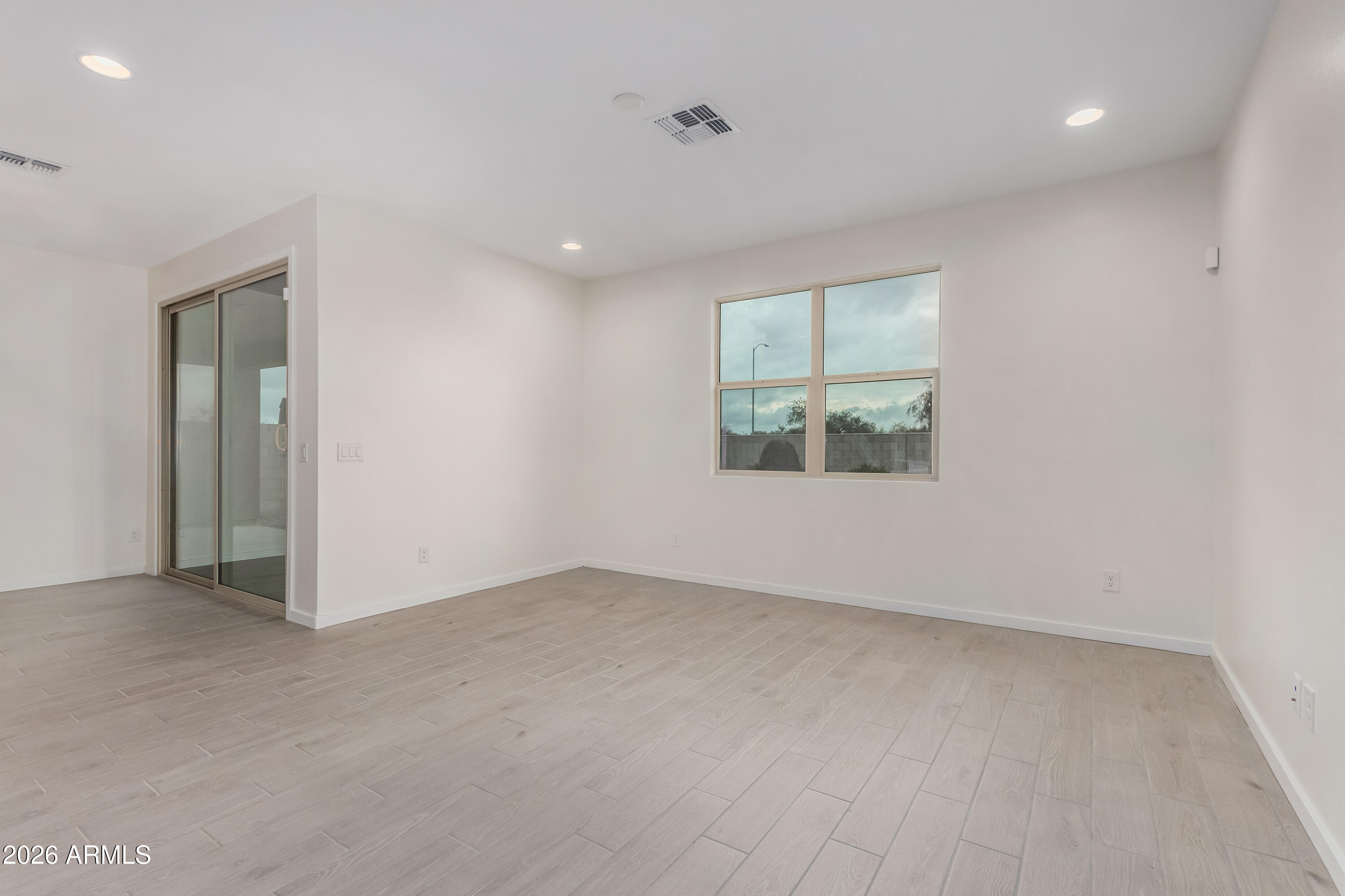 17352 West Red Fox Road Surprise, AZ 85387 - Photo 14 of 45 an empty room with a window