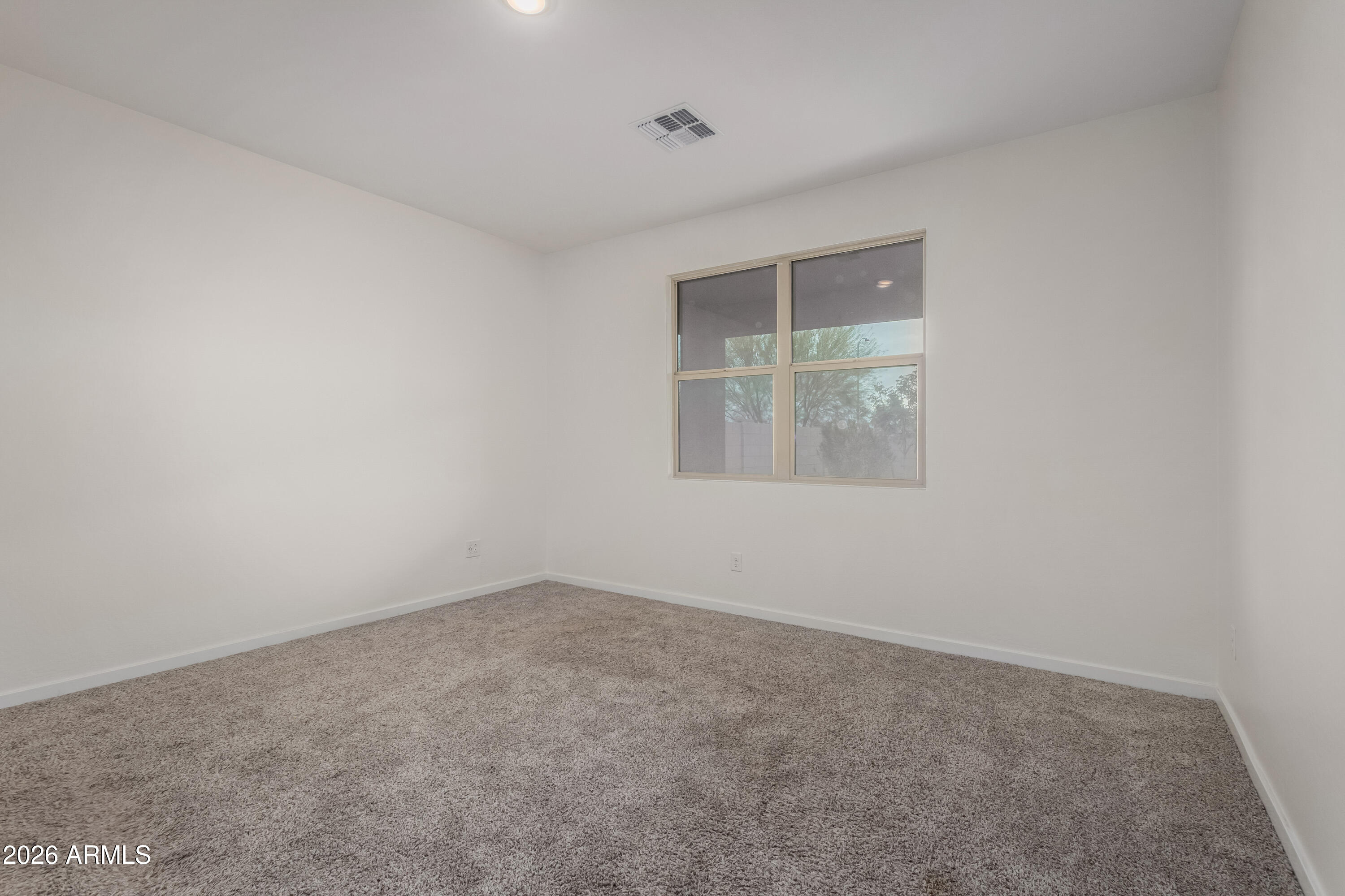 17352 West Red Fox Road Surprise, AZ 85387 - Photo 16 of 45 an empty room with a window