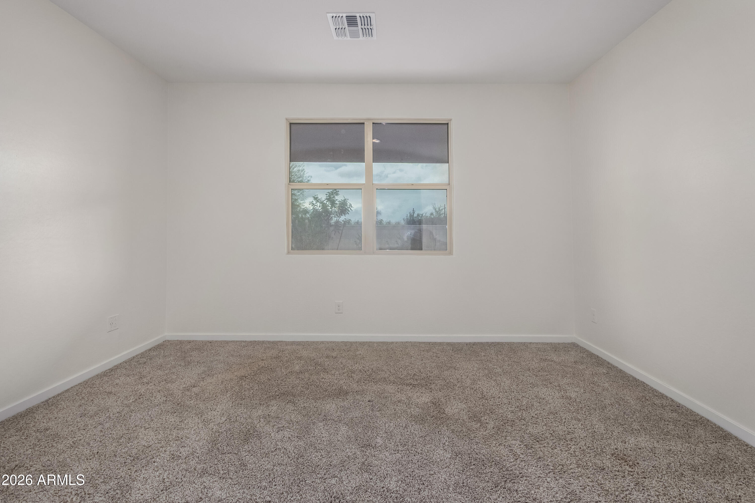 17352 West Red Fox Road Surprise, AZ 85387 - Photo 17 of 45 an empty room with a window