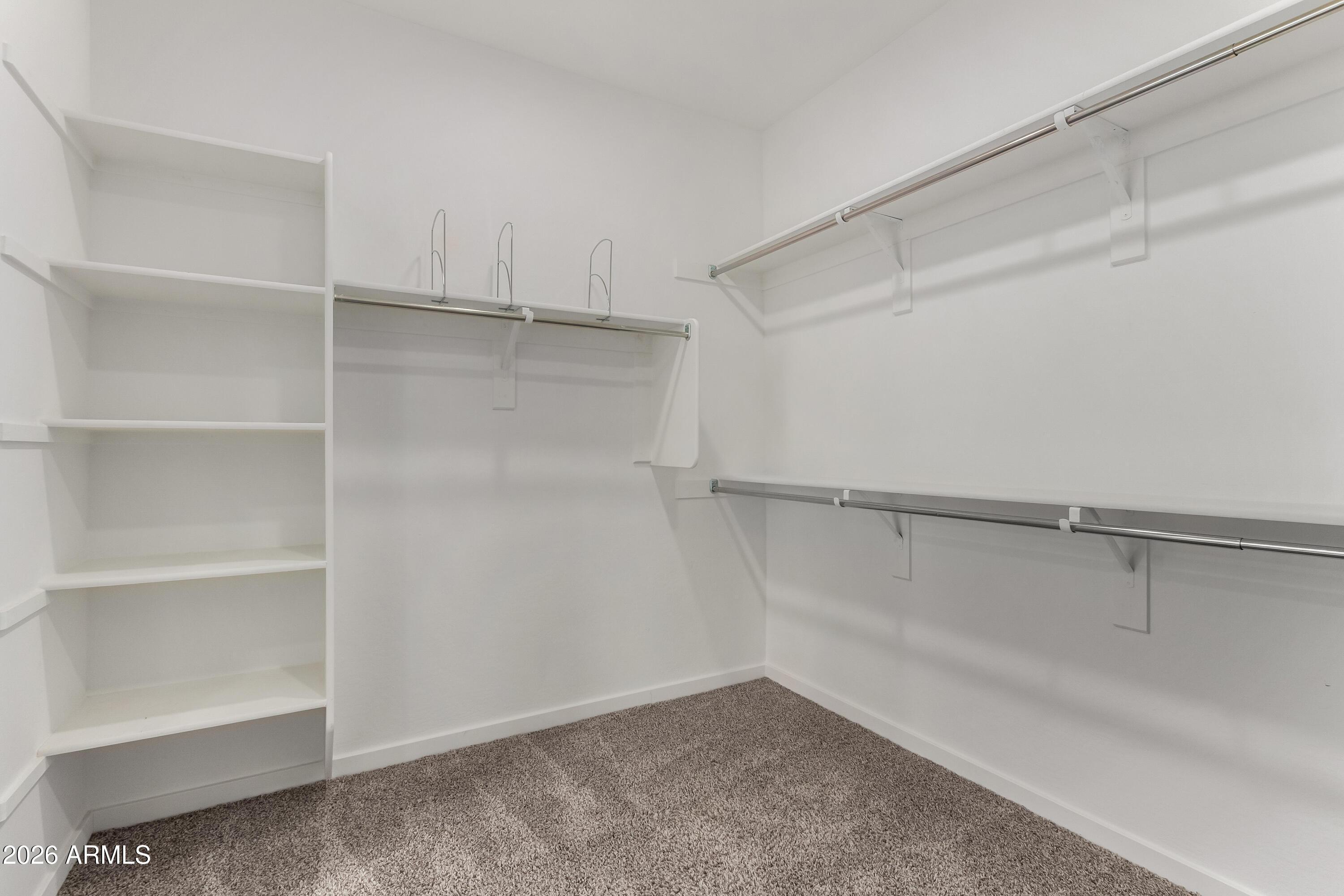 17352 West Red Fox Road Surprise, AZ 85387 - Photo 20 of 45 a view of an empty walk in closet