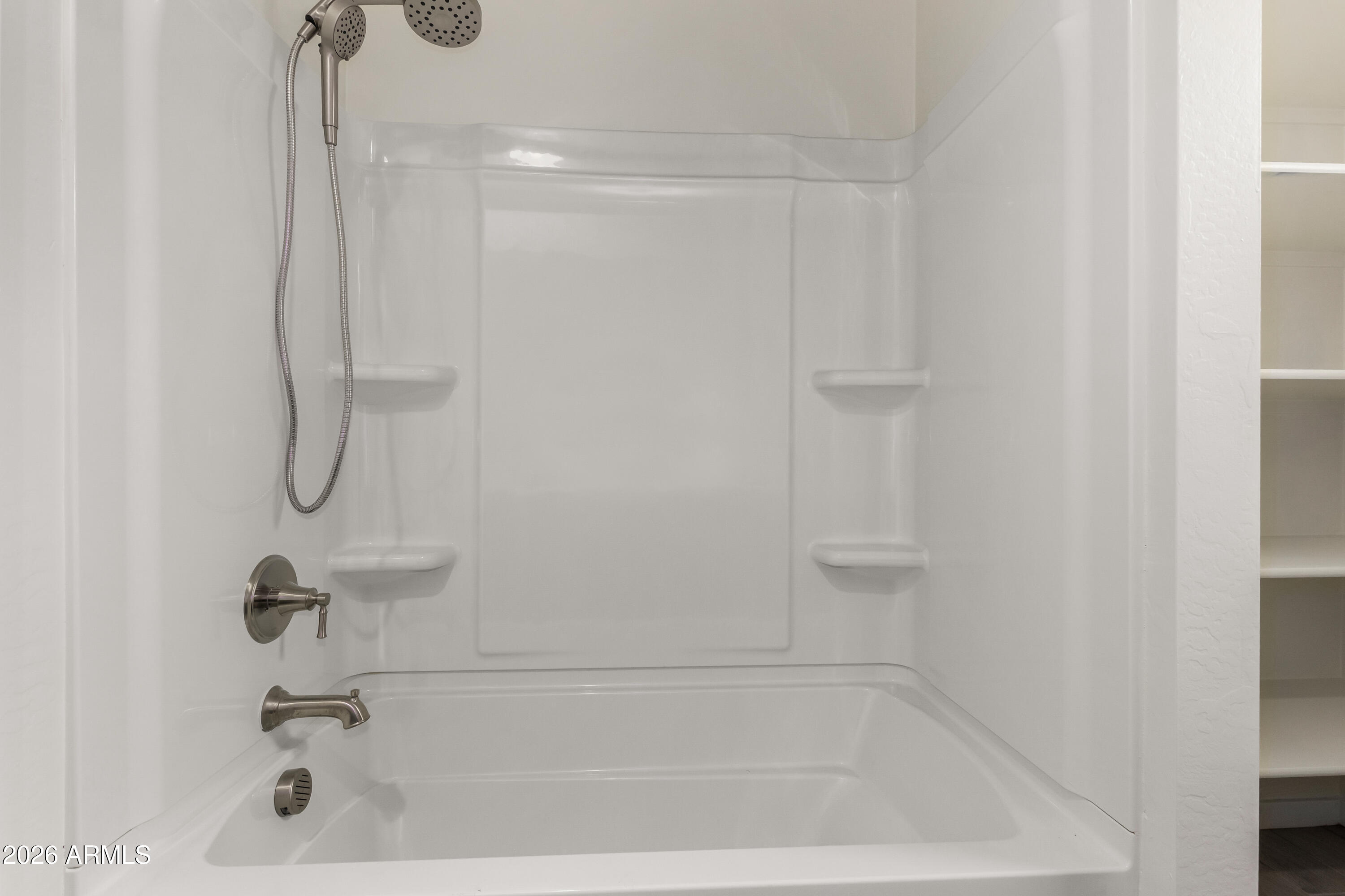 17352 West Red Fox Road Surprise, AZ 85387 - Photo 33 of 45 a bathroom with a bath tub