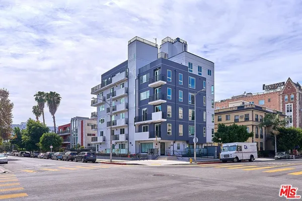 a view of a building with a street