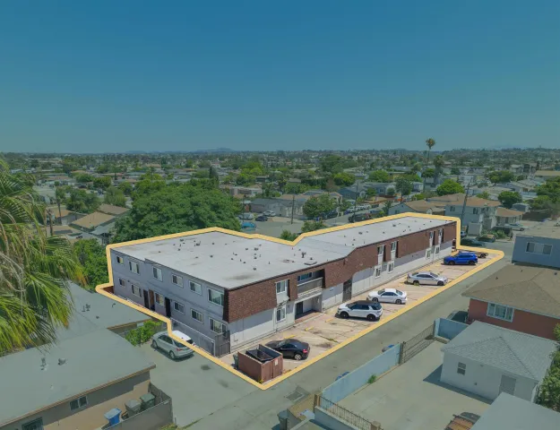 a view of a balcony with a table and chairs