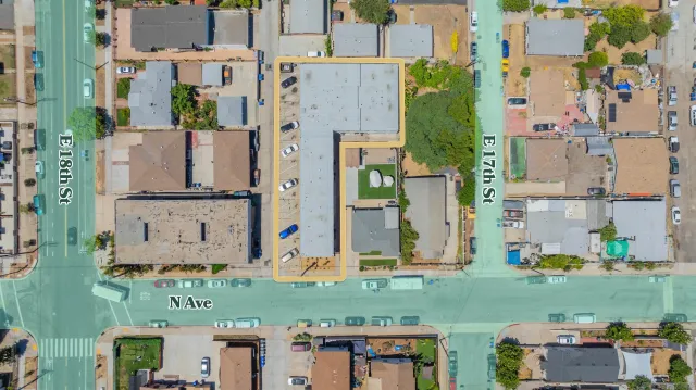 an aerial view of a city with streets and houses