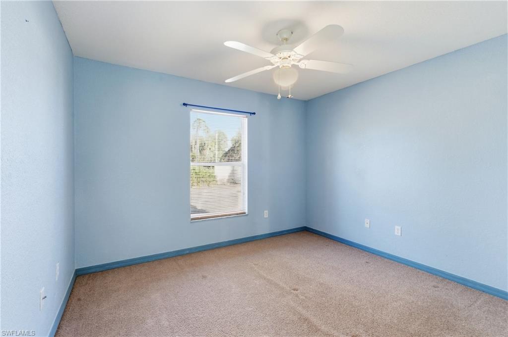 1562 Jakway Road North Port, FL 34288 - Photo 31 of 50 Empty room featuring carpet floors and a ceiling fan