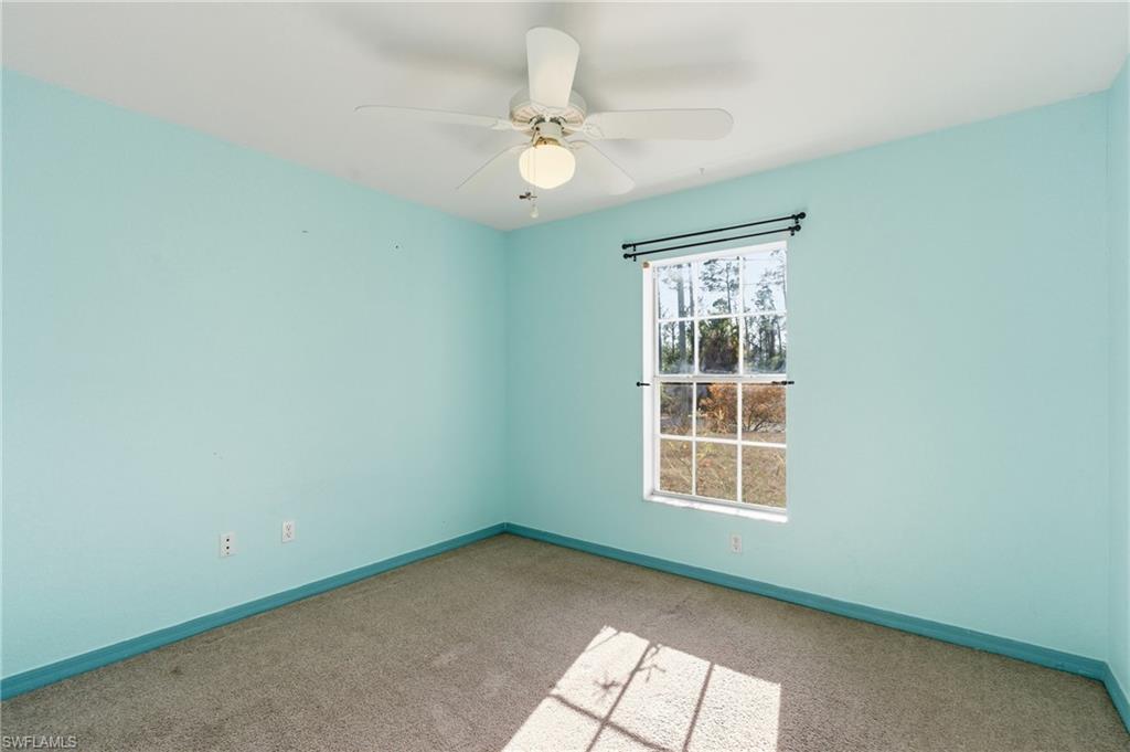 1562 Jakway Road North Port, FL 34288 - Photo 33 of 50 Carpeted empty room with baseboards and a ceiling fan