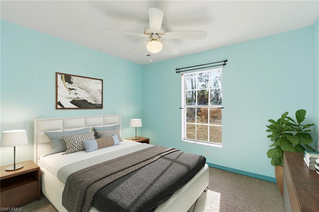 1562 Jakway Road North Port, FL 34288 - Photo 6 of 50 Bedroom featuring carpet flooring and a ceiling fan