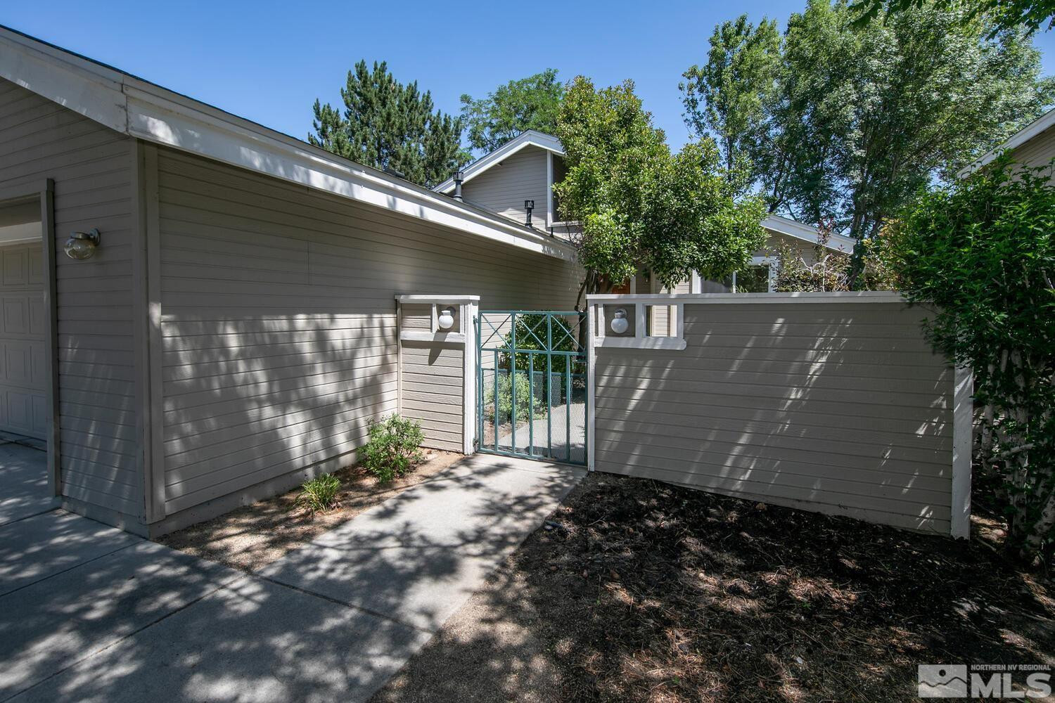 3335 Spring Creek Circle Reno, NV 89509 - Photo 23 of 30 a view of a house with a yard