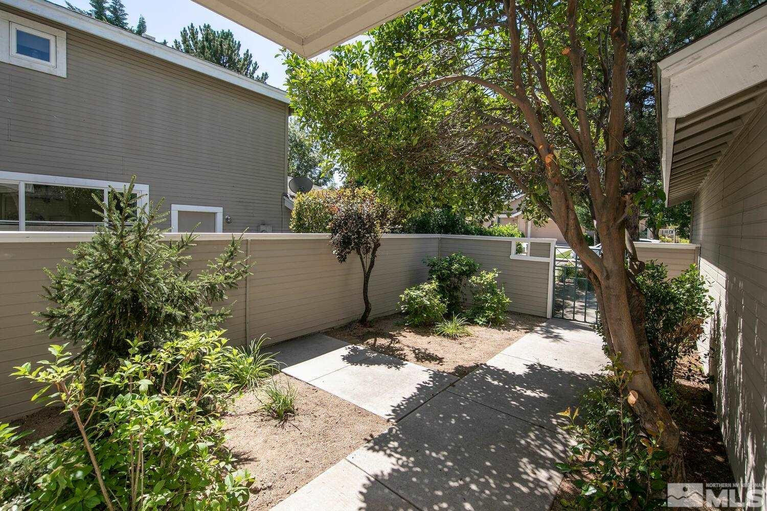 3335 Spring Creek Circle Reno, NV 89509 - Photo 24 of 30 a backyard of a house with a yard and outdoor seating