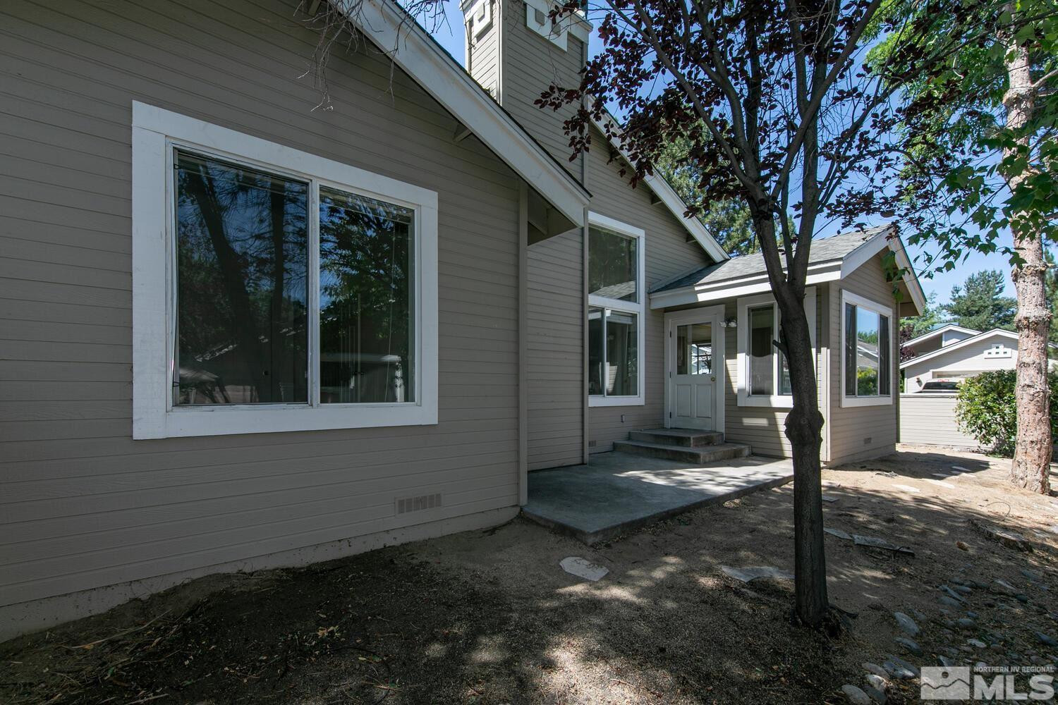 3335 Spring Creek Circle Reno, NV 89509 - Photo 25 of 30 a view of a house with backyard and tree