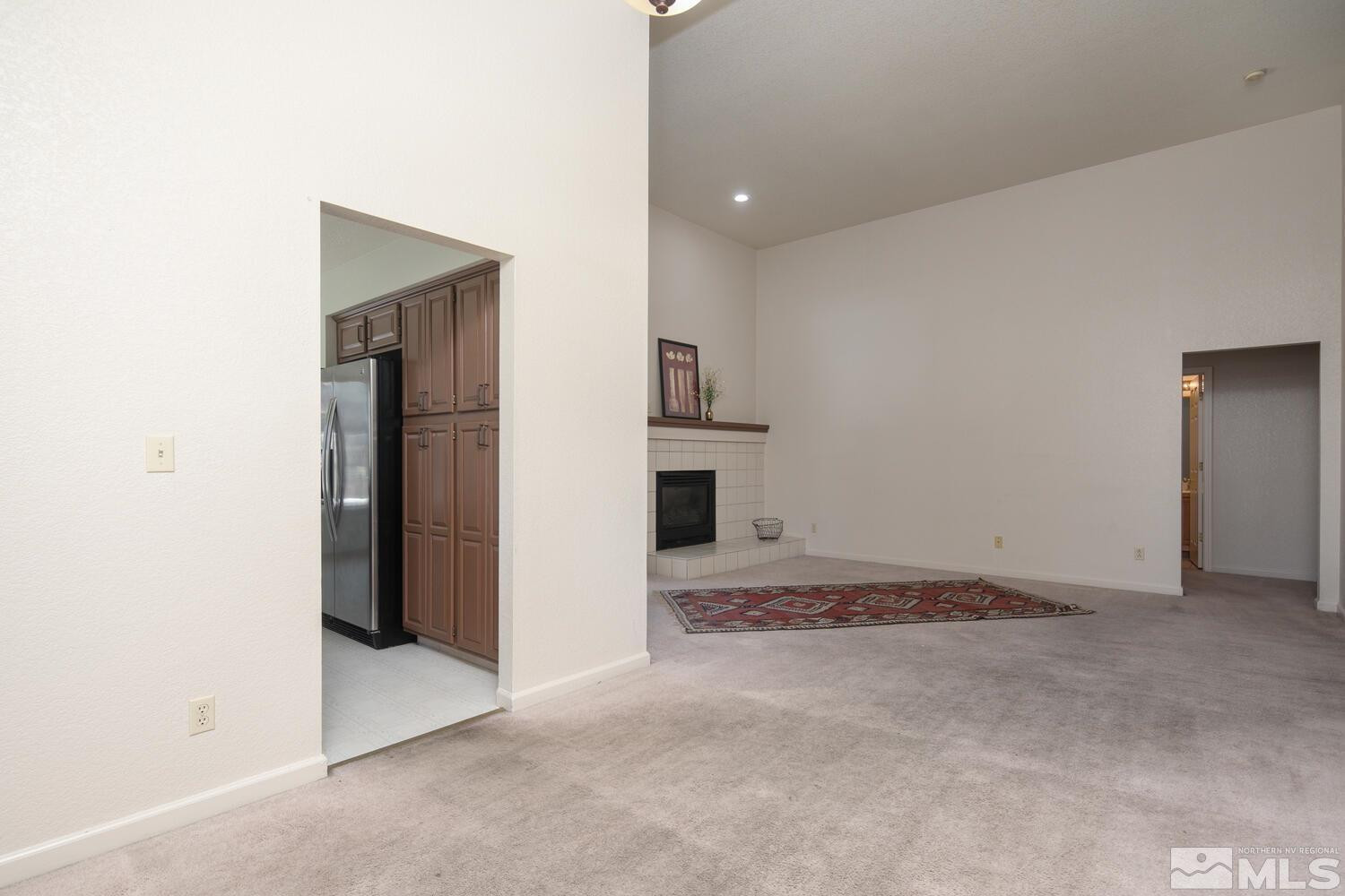 3335 Spring Creek Circle Reno, NV 89509 - Photo 6 of 30 an empty room with a fireplace