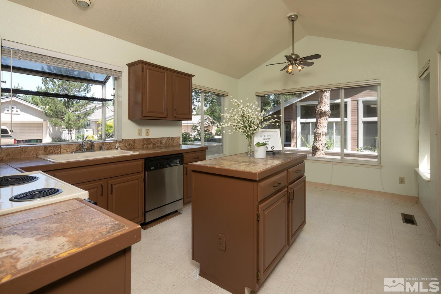 3335 Spring Creek Circle Reno, NV 89509 - Photo 7 of 30 a kitchen with a sink stove and microwave
