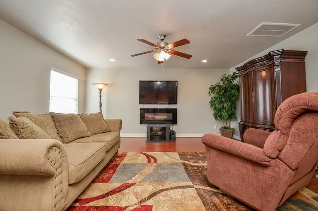 a living room with furniture and a large window