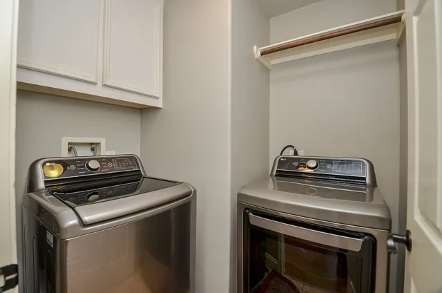 a white toilet sitting next to a bathroom sink