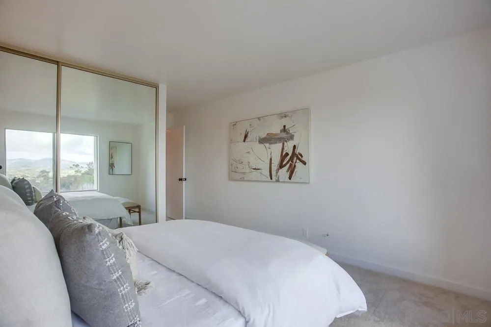 1870 Forestdale Drive Encinitas, CA 92024 - Photo 12 of 19 a bedroom with a bed and a painting on the wall