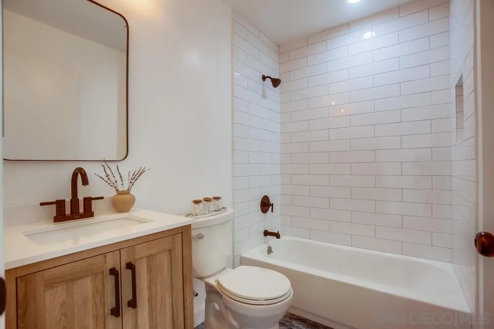 1870 Forestdale Drive Encinitas, CA 92024 - Photo 13 of 19 a bathroom with a bathtub shower sink vanity mirror and toilet