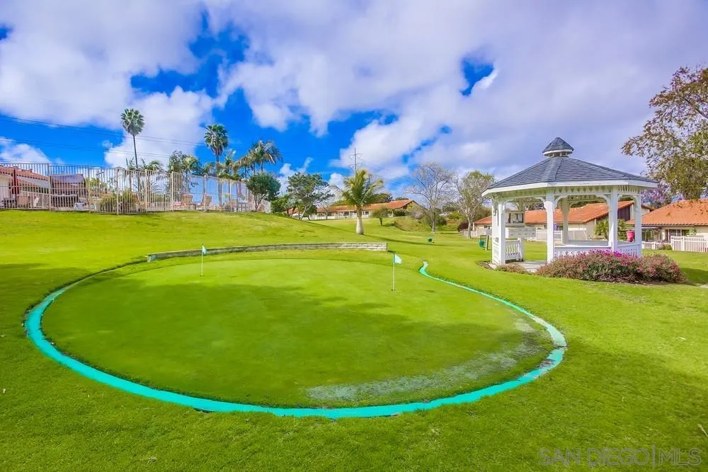 1870 Forestdale Drive Encinitas, CA 92024 - Photo 16 of 19 a view of a swimming pool with a yard and a fountain