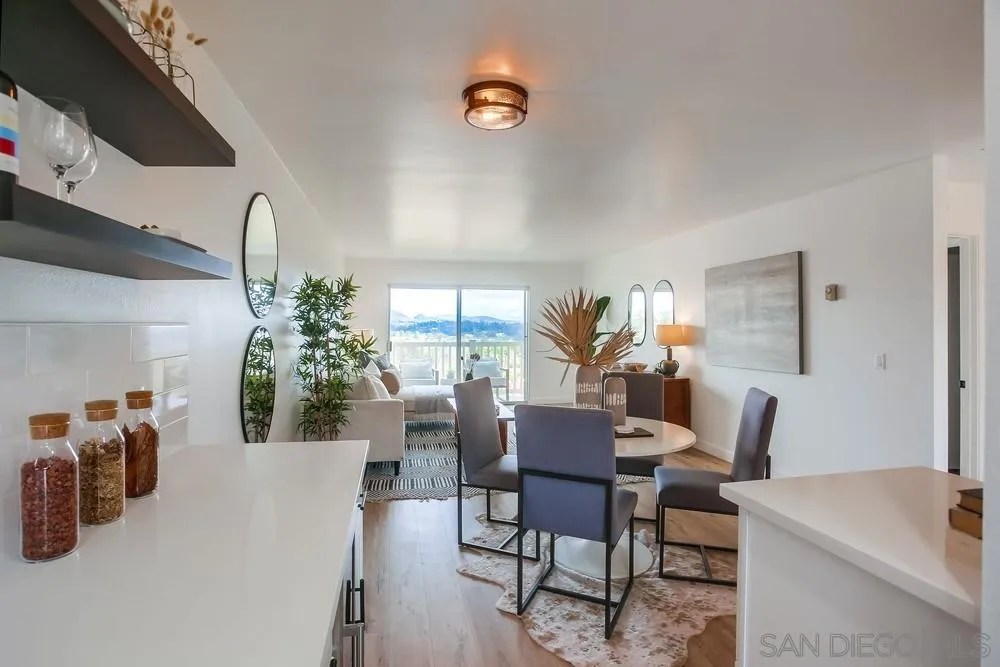 1870 Forestdale Drive Encinitas, CA 92024 - Photo 8 of 19 a view of a dining room with furniture and a potted plant