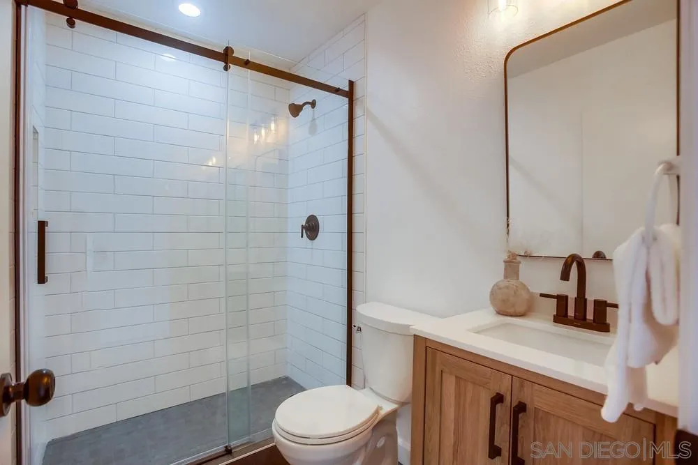 1870 Forestdale Drive Encinitas, CA 92024 - Photo 9 of 19 a bathroom with a sink a toilet and shower