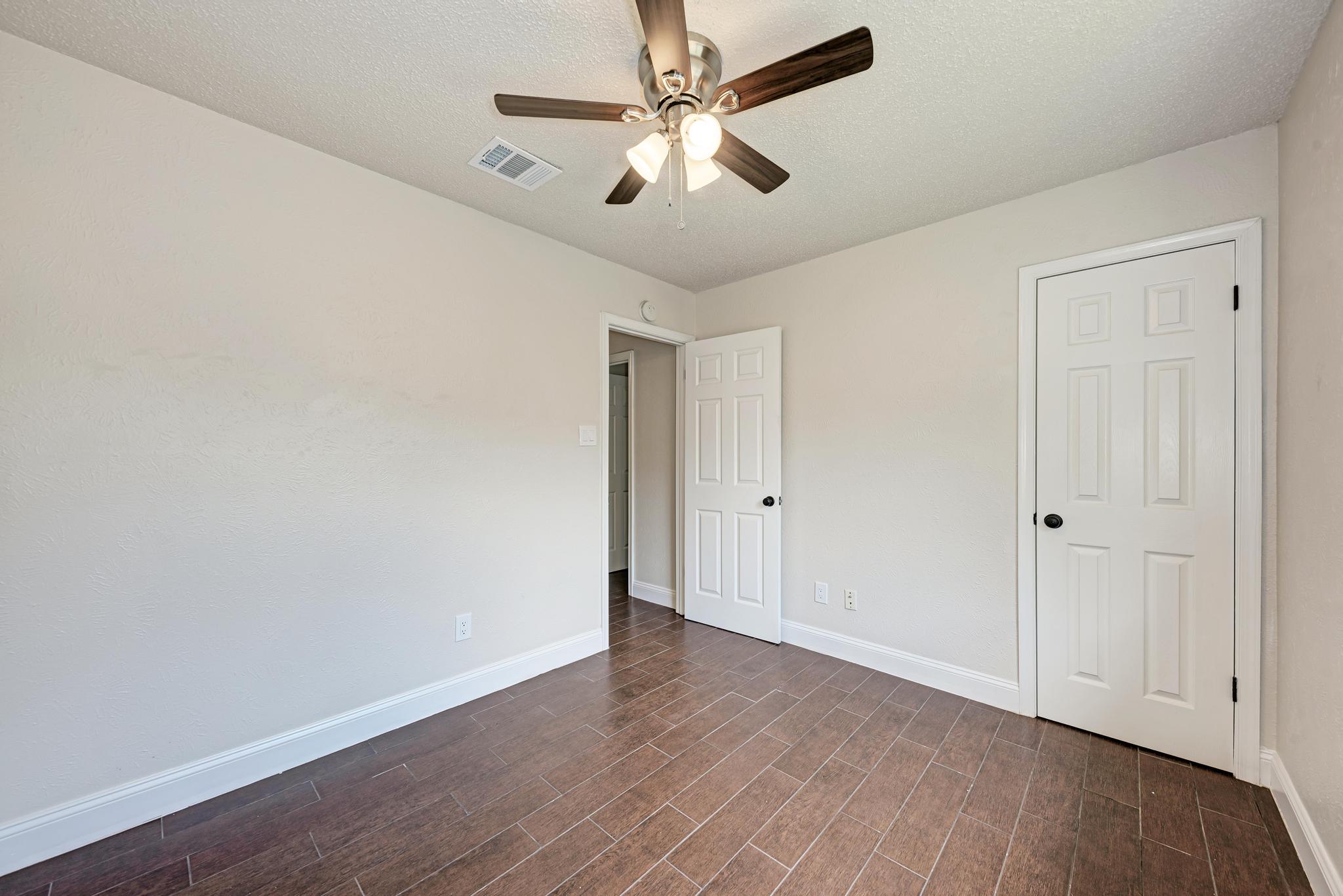 12108 Carnforth Drive Austin, TX 78753 - Photo 27 of 33 wooden floor in an empty room