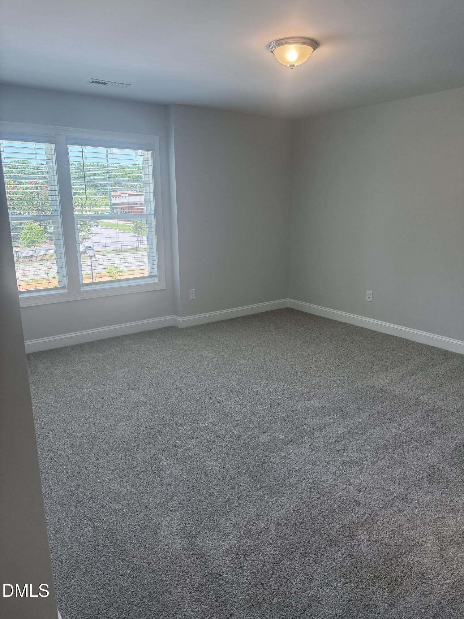 1920 Fishamble Street Fuquay-Varina, NC 27526 - Photo 13 of 23 an empty room with a window